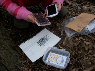 Letterboxer stamping into their logbook